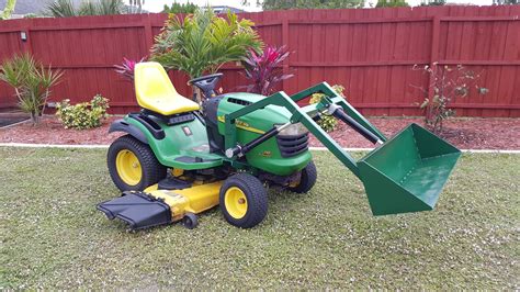 It has a wide working deck and lifts capacity of 512/570 lbs. . Electric front end loader for garden tractor